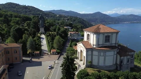 Drone panoramic shot of the statue of San Carlo in Arona, Lake Maggiore Stock Footage 324863668