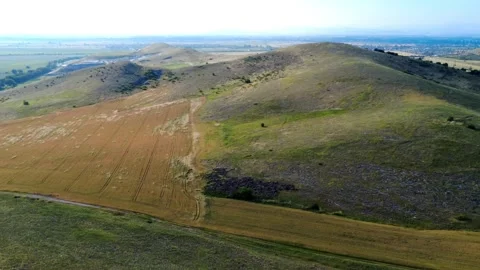 Drone panoramic view of green hills, cultivated fields, and open landscape . Stock Footage 311159189