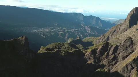 Drone Panoramic View of Rugged Volcanic Caldera with Distant Ocean Horizon Stock Footage 315089970