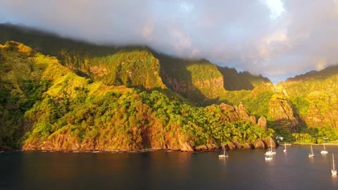 Drone pans across anchorage at a remote tropical island Stock Footage 308518563