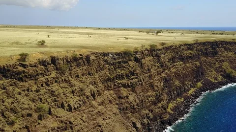 Drone pans to right over cliffs of island 스톡 동영상 101998022