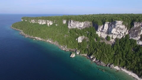 Drone pans while flying to expose long peninsula part of Niagara Escarpment Video stock 91904295