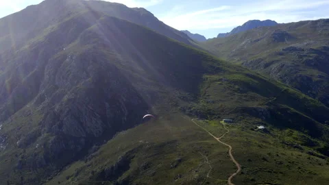 Drone, paragliding person and mountains in summer, extreme sports or adventure Video stock 260995553