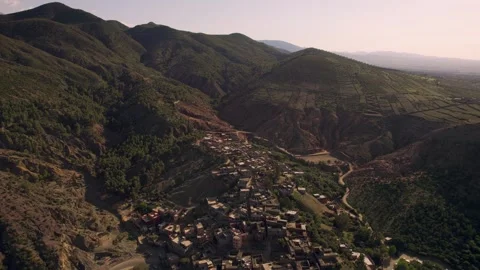 Drone parallax orbit pullback above Berber village in the Ourika Valley Morocco Stock Footage 337055811