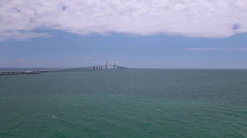 Drone parallax view approaching the Sunshine Skyway Bridge over Tampa Bay Stock Footage 335475281