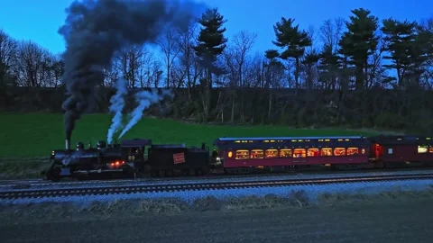 Drone Parallel Night View of a Steam Passenger Train Stopped in Farmlands B.. Video stock 230116752