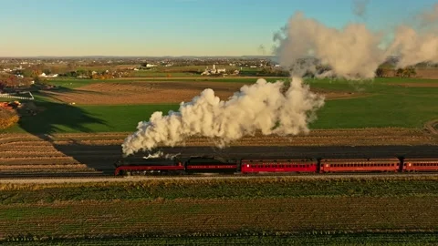 Drone Parallel View of a Steam Engine Blowing Lots of Smoke in the Early Mo.. Stock-Footage 230115542