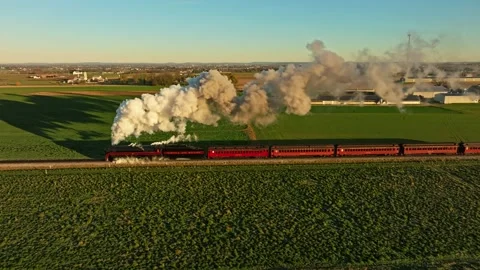 Drone Parallel View of a Steam Engine Blowing Lots of Smoke in the Early Mo.. Stock Footage 232909167