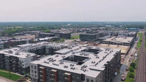 Drone of parking garage first level construction crew working at apartments Stock Footage 341893224