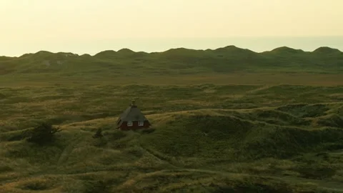 Drone pass beautiful old thatched roof summer house on the Danish west coast Stock Footage 272295016