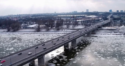 The drone passes over the ?azienkowski bridge, under which the frozen Vistula Stock-Footage 107623357