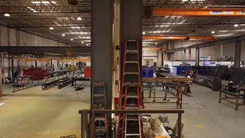 Drone passes structural steel workstations Stock Footage 347120760