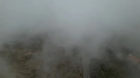 The drone passes through the clouds across residential areas. Aerial view Stock Footage 263277676
