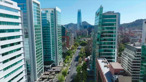 Drone passing between glass buildings, Santiago Stock Footage 340992958