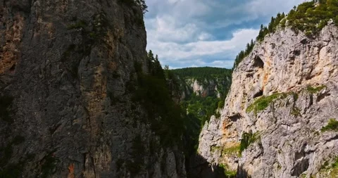 Drone Passing Between High Cliffs Curved Mountain Road Passage Evergreen Forest Stock Footage 300479160