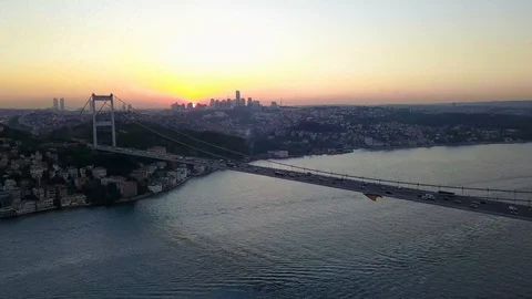 Drone passing over the Bosphorus bridge as sunsets down in Istanbul and Stock Footage 116815477