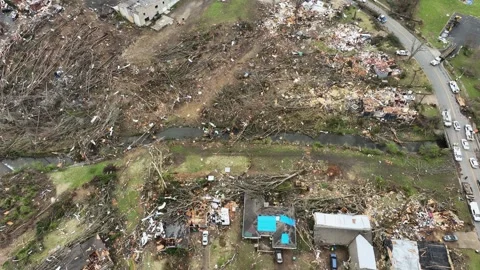 Drone passing over devastation in aftermath of tornado outbreak. Video stock 266950099