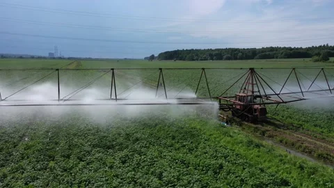 Drone passing over irrigated farmland in Moscow region Video stock 329054879