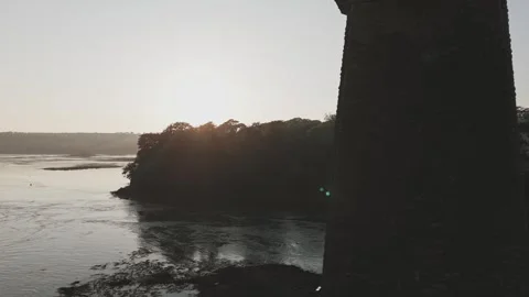 Drone passing through bridge during sunset Stock Footage 277622788