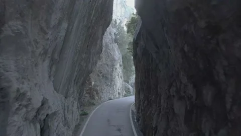 Drone passing through narrow rock formation Stock Footage 197560923