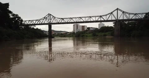 Drone passing under Ponte Aldo Pereira de Andrade on Itajaí-Açu River Stock Footage 317735684