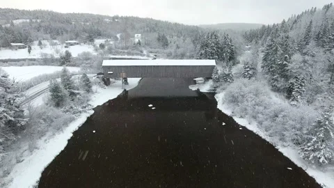 Drone Passover of Covered Bridge withe Large Snowflakes Stock Footage 172423842