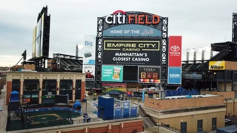 Drone pedestal down of back of Citi Field exterior signage Stock Footage 106513920