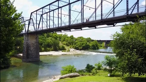 Drone pedestrian bridge waterfall Stock Footage 78579357