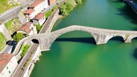 Drone perspective of historic Devils Bridge Ponte della Maddalena over Serc.. Stock Footage 336470042