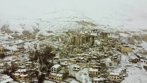 Drone perspective of Lamayuru Monastery under a gentle snowfall. Stock Footage 310660998