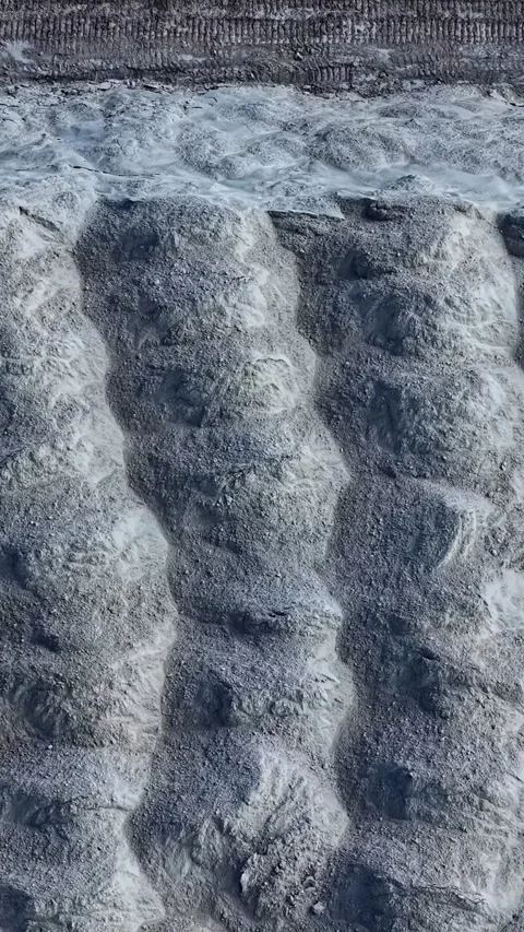 Drone perspective of a large phosphogypsum storage stack Stock Footage 346578203