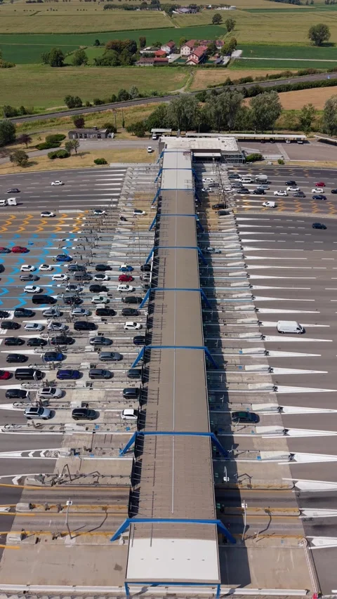 Drone perspective of a major toll station on the A1 motorway near Milan, Italy Stock Footage 344956333