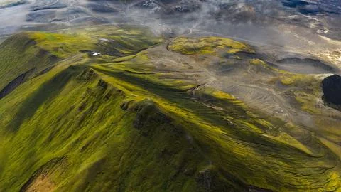 Drone perspective of moss-covered lava fields and volcanic terrain in South I Stock Photos