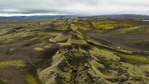 Drone perspective of moss-covered lava formations and cinder cones in southea Stock Photos