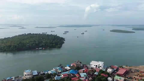 Drone Perspective Over Lush Tropical Islands, Vibrant Coastal Settlements Stock Footage 325190642