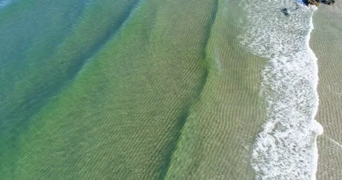 Drone perspective of repetitive ocean wave patterns. The Concept of Harmony. Stock Footage 325907820