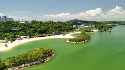 Drone perspective of Sentosa beach with crystal clear sea, tropical greener.. Stock Footage 319370722