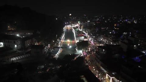 Drone perspective shows Chhath Puja devotion unfolding along riverbanks in Stock-Footage 324959041