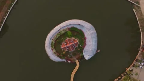 Drone perspective of Sumeru Mountain temple above calm waters Stock Footage 304373874