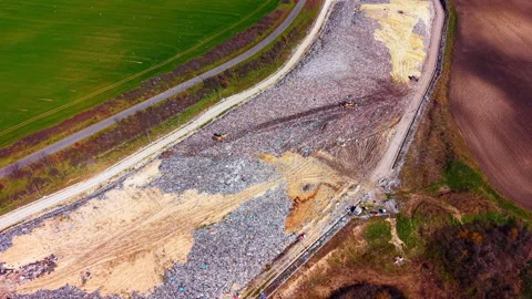 Drone perspective of waste dump between farmland plots, Bulgaria Stock-Footage 345150681