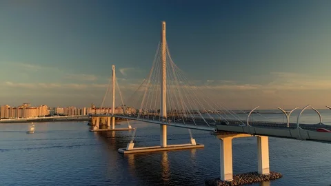 Drone Petersburg modern cable-stayed bridge over Neva river cityscape sunset 4k Stock Footage 128749463