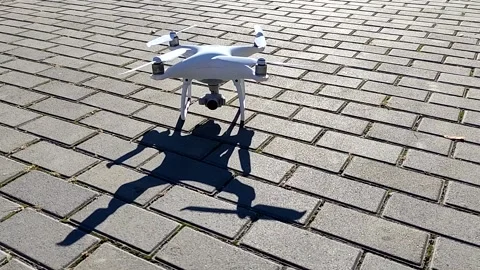 Drone Phantom 3 rises into the air from the ground Video stock 163813266