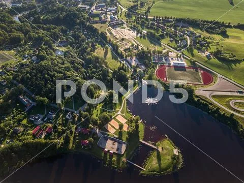 Drone Photo of the City with the Lake and Stadium Stock Photos