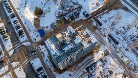 Drone photography of constructions workers working on new building rooftop .. Stock Photos