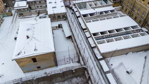 Drone photography of old prison backyard during winter Stock-Fotos