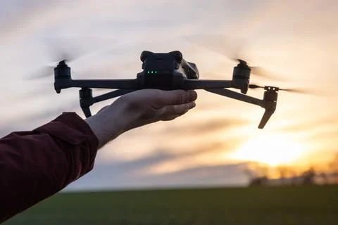 Drone Pilot Controls Drone to Take Off From Hand Stock Photos