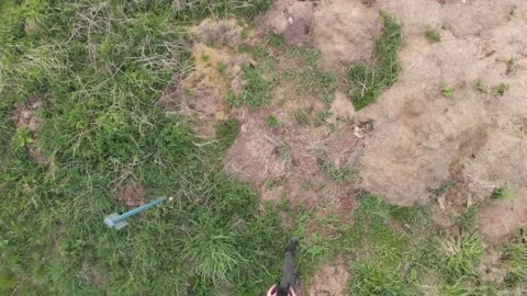 Drone pilot on the grass from the sky Stock Footage 130664377