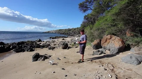 Drone Pilot, Operator, Launching From Tropical Beach Stock-Footage 71811229