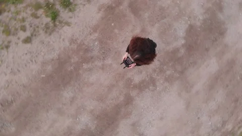 Drone pilot viewed from the sky Stock Footage 130664948