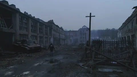 Drone pilot walking through the ruins of the old city in the dusk with drone Stock Footage 150902880